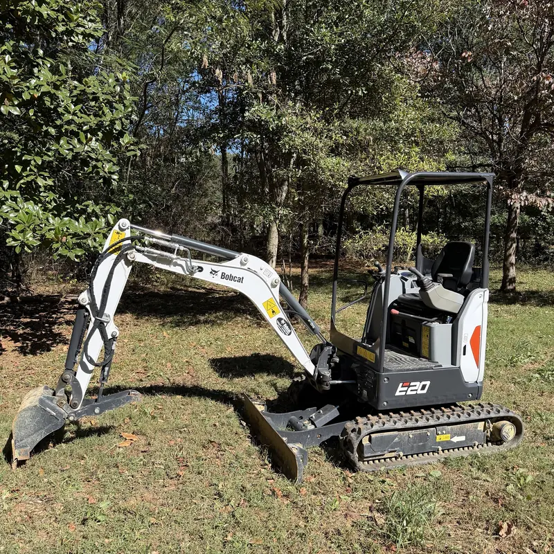 Bobcat E20 mini excavator with bucket, thumb and blade