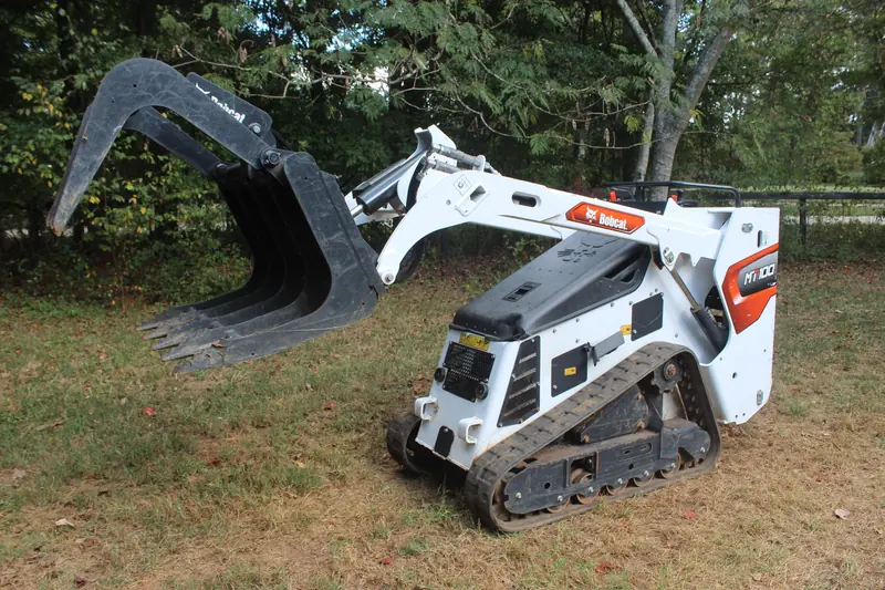 Bobcat MT100 with the grapple raised